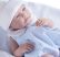 Berenguer újszülött élethű fiú játékbaba kék pöttyös ruhában takaróval 43cm